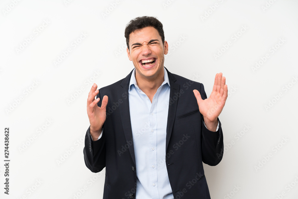© luismolinero - Handsome man over isolated white wall laughing