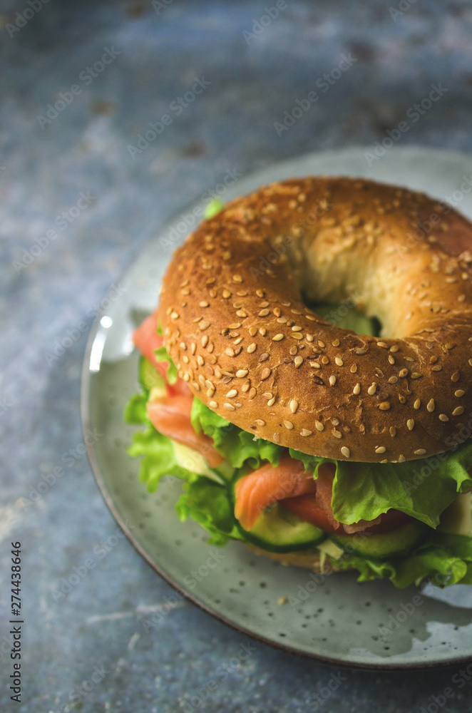 Bagel with salmon and vegetables, breakfast