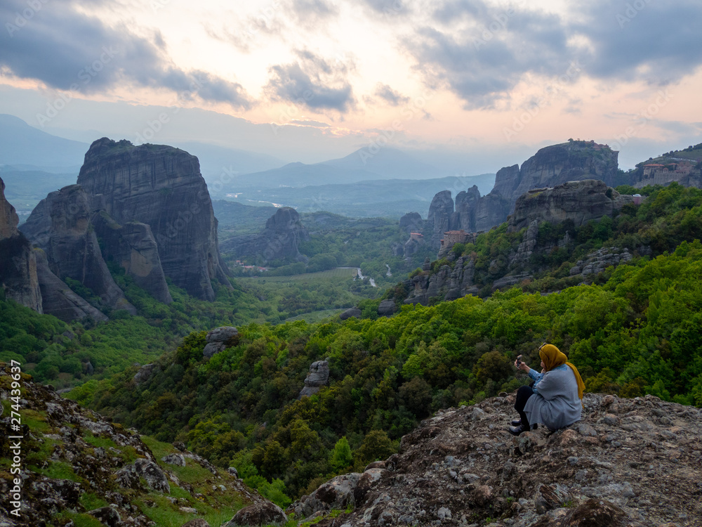 Photo of the panoramic view of the meteora valley at sunset