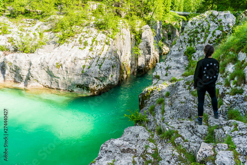 Quadro em tela Young girl looking at the Soca River in Lepena