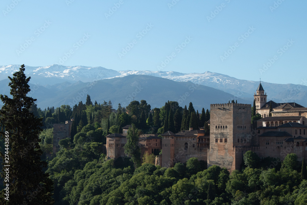 Panoramic view of the Alhambra, Sierra Nevada mountains, opening from the sightseeing area of ​​the Albaicin area in the early morning, Granada, Andalusia, Spain