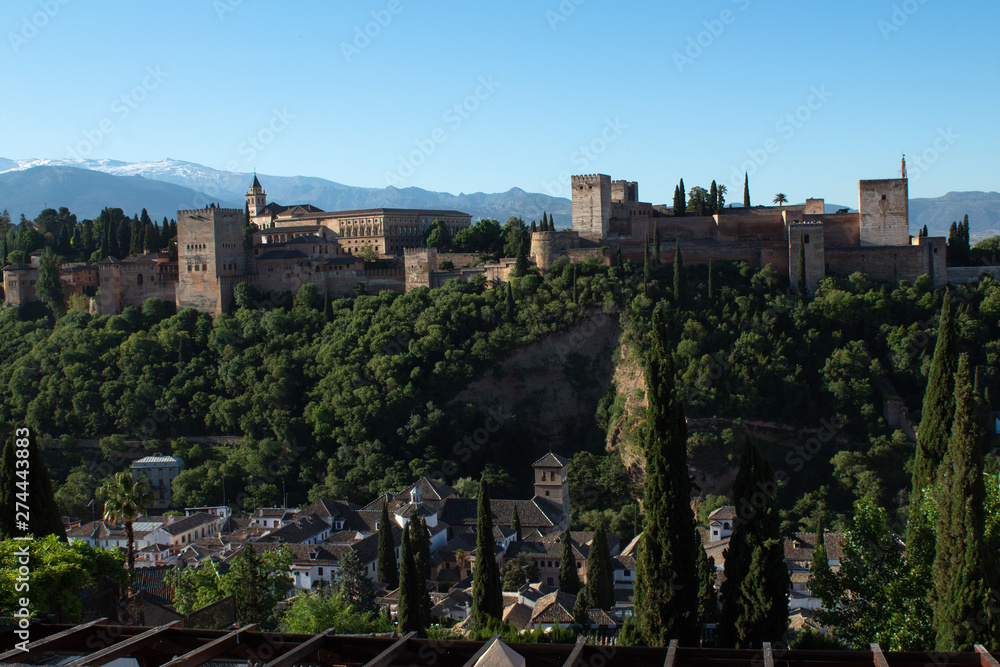 Panoramic view of the Alhambra, Sierra Nevada mountains, opening from the sightseeing area of ​​the Albaicin area in the early morning, Granada, Andalusia, Spain