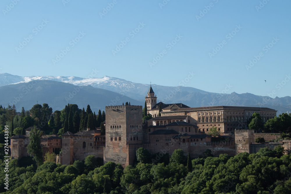 Panoramic view of the Alhambra, Sierra Nevada mountains, opening from the sightseeing area of ​​the Albaicin area in the early morning, Granada, Andalusia, Spain