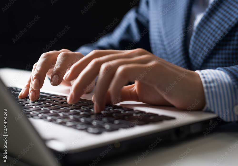 Man in business suit sitting at desk Man in business suit sitting at desk