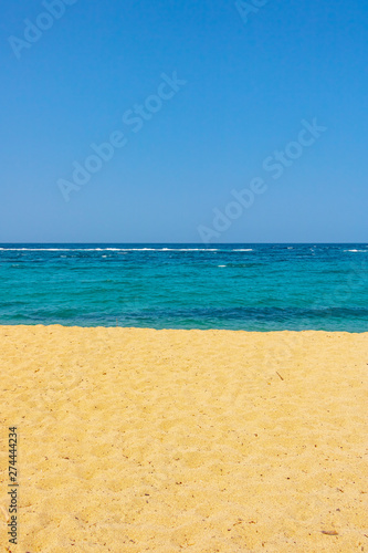 sand beach sea and blue sky as an straight beautiful line formation