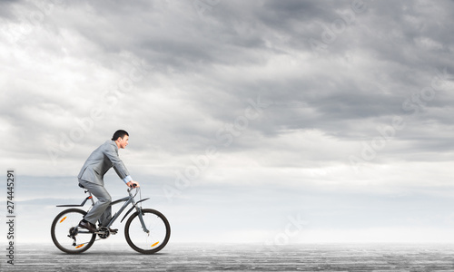 Businessman commuting to work by bike