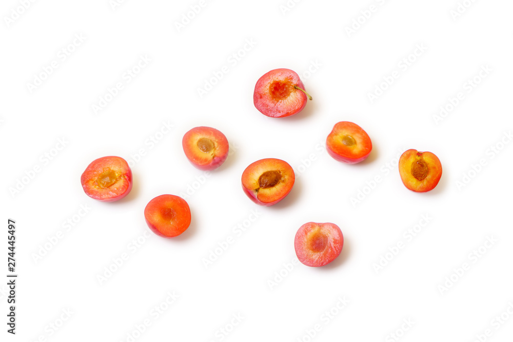 Halves of sweet plums isolated on white background Halves of sweet plums isolated on white background