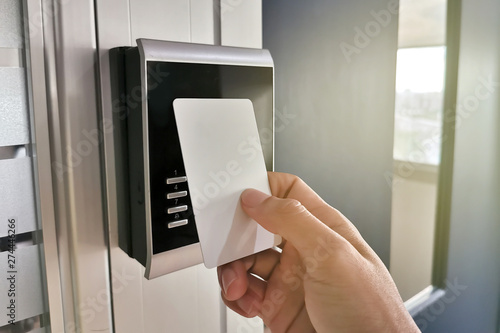 Hand using Key card;access control concept photo