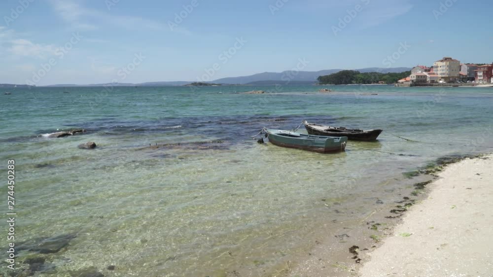 Small boats called Chalana anchored on the beach. Rias Baixas seascape, Carril, Galicia, Spain Small boats called Chalana anchored on the beach. Rias Baixas seascape, Carril, Galicia, Spain