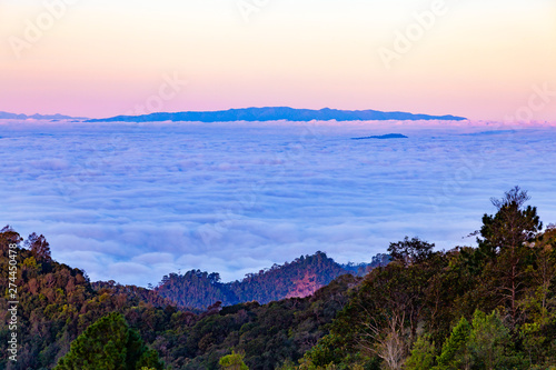 Mountains landscape with fog under morning sky.