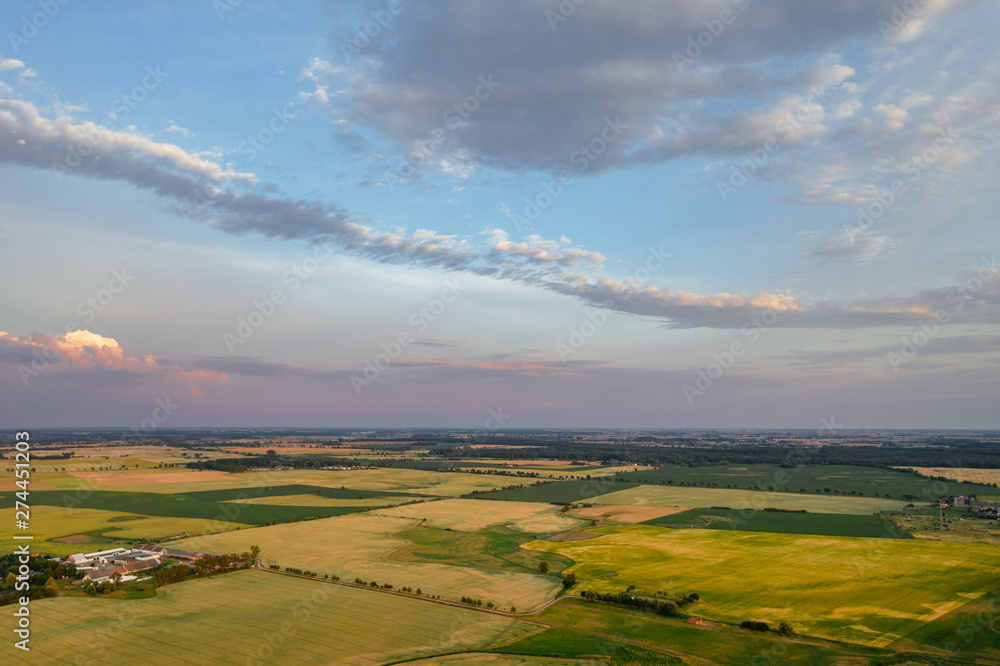 Fototapeta premium Sunset sky over agricultural fields in western Poland.