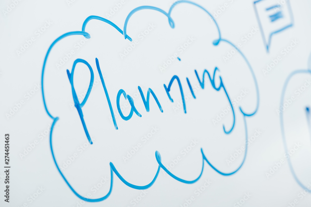 close up view of word planning written on white flipchart close up view of word planning written on white flipchart