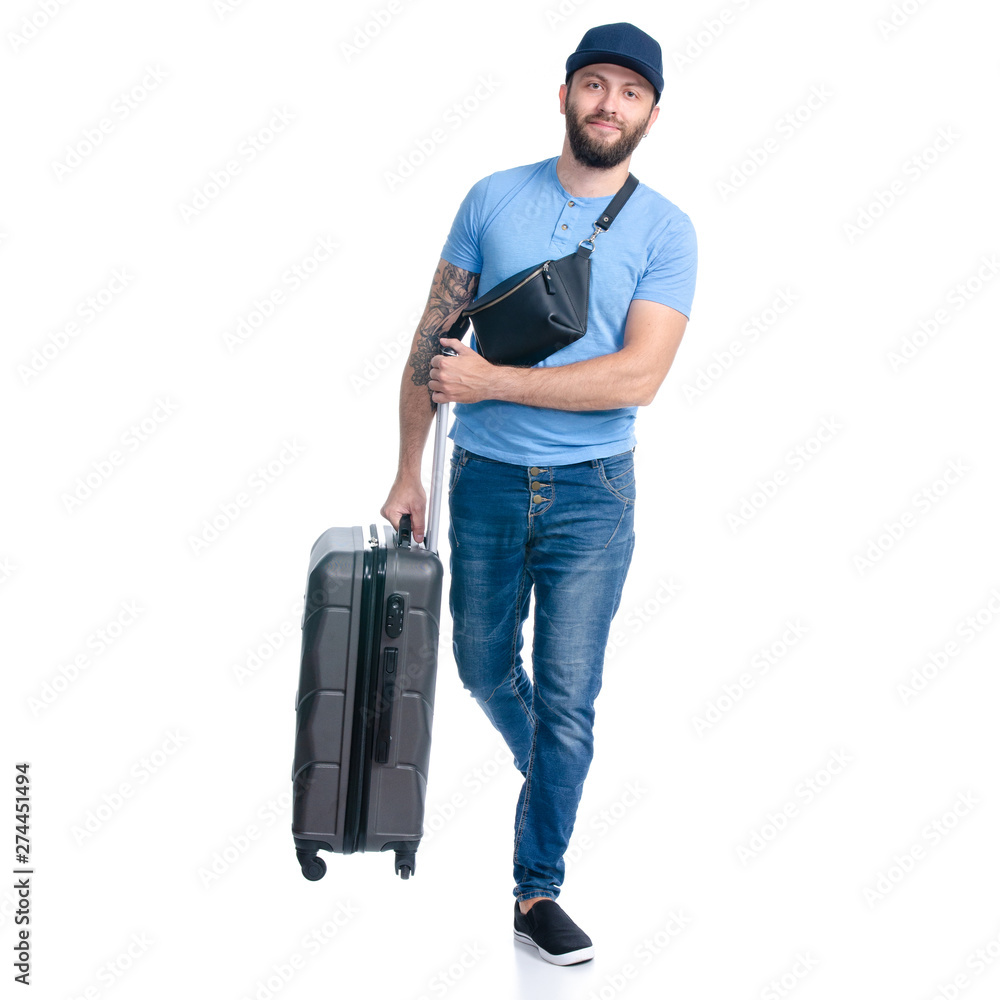 Man in jeans with travel suitcase goes walking on white background isolation Man in jeans with travel suitcase goes walking on white background isolation