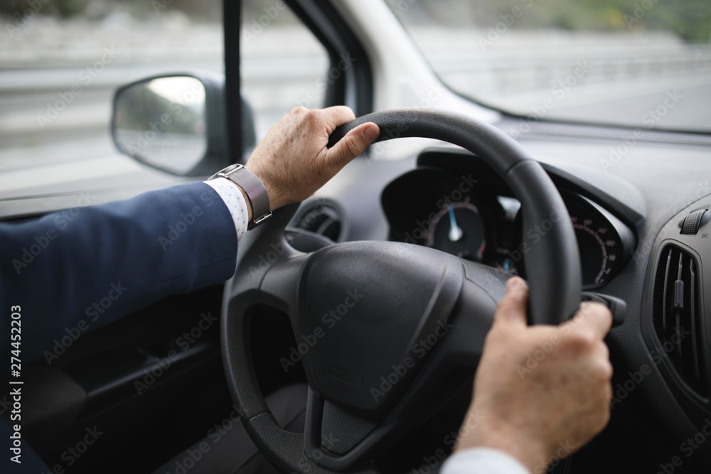 Businessman driving car