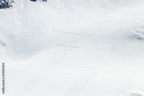 ski touring tracks in the fresh powder snow