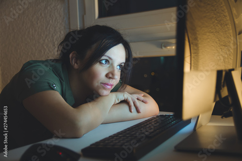 Concentrated businesswoman working late hours