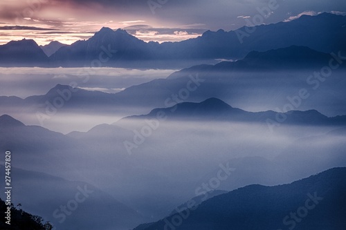 View of the foggy valley in Sierra Nevada de Santa Marta, Cordillera, Colombia dramatic scene, beautiful world,scenic view with cloudy sky, majestic impressive dawn in mountain landscape, wallpaper