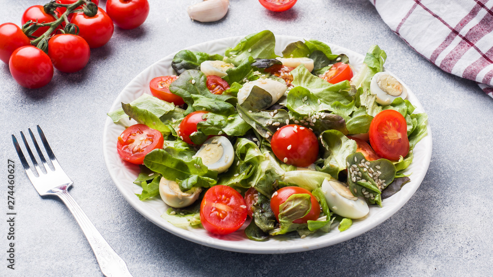 Fresh salad with tomatoes and quail eggs and lettuce. Fresh salad with tomatoes and quail eggs and lettuce.