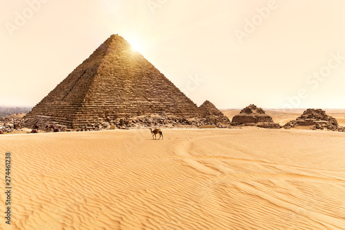 View on the Pyramid of Menkaure and three small pyramids in Giza, Egypt
