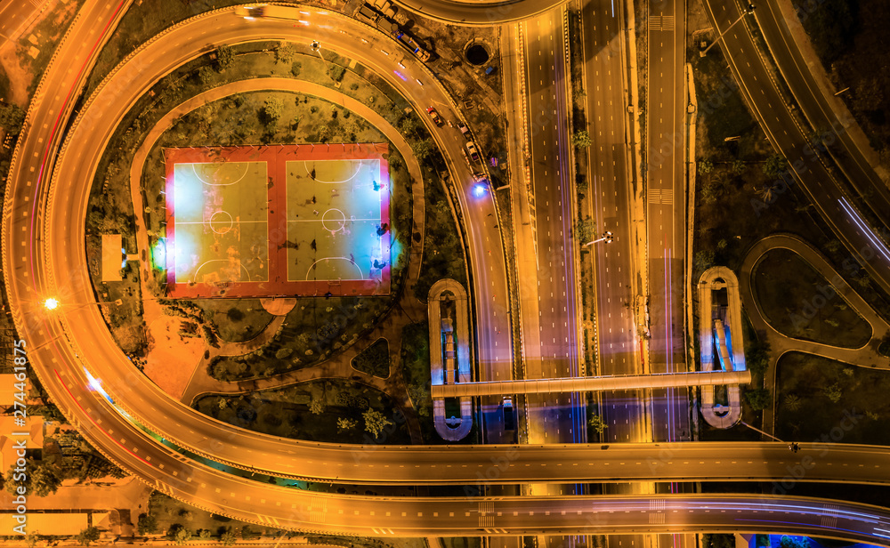 Obraz premium Aerial view Expressway motorway highway circus intersection at Night time Top view , Road traffic in city at thailand.