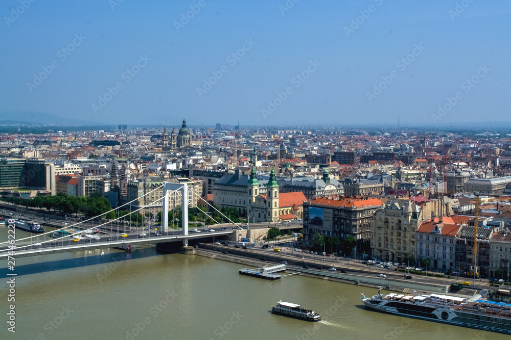 12.06.2019. Budapest, Hungary. A view of the new, wide and modern bridge through the Danube River of white color. Traffic intersection. Cars.