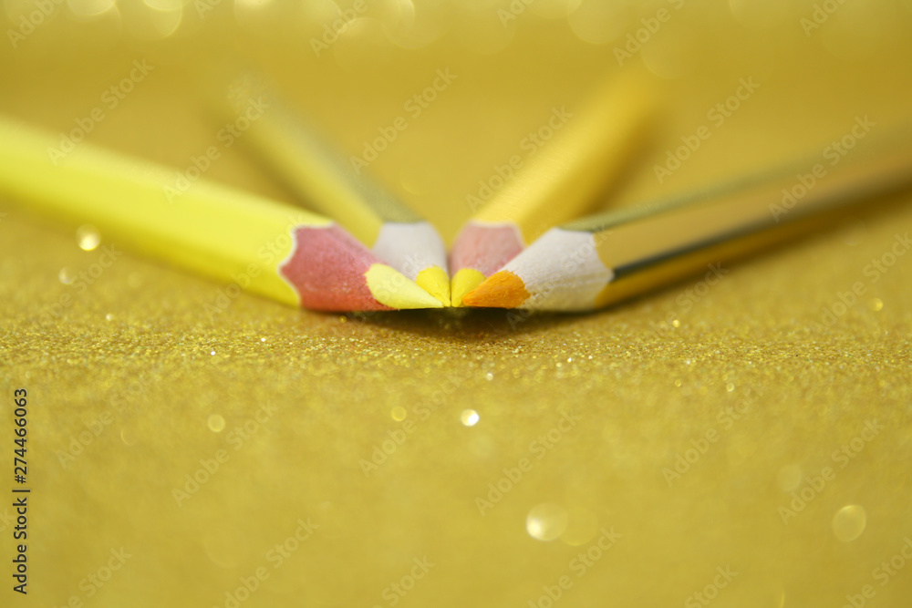 YELLOW PENCILS OVER GOLDEN BRIGHT YELLOW PENCILS OVER GOLDEN BRIGHT