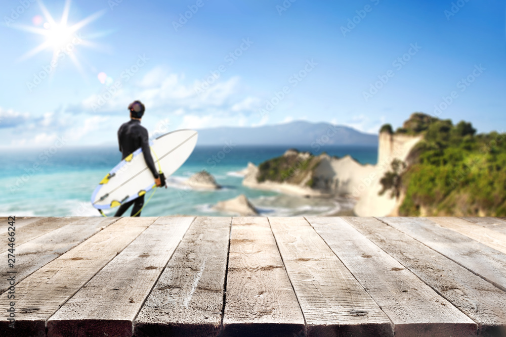 Desk of free space and summer blurred background of beach with sea 