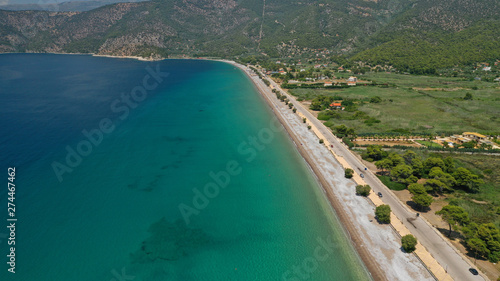 Aerial panoramic photo of famous sandy beach of Psatha in West Attica with emerald clear sea, Corinthian gulf, Greece