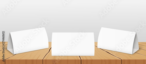 Set of three blank table tent cards to presentate design realistic vector mockup.