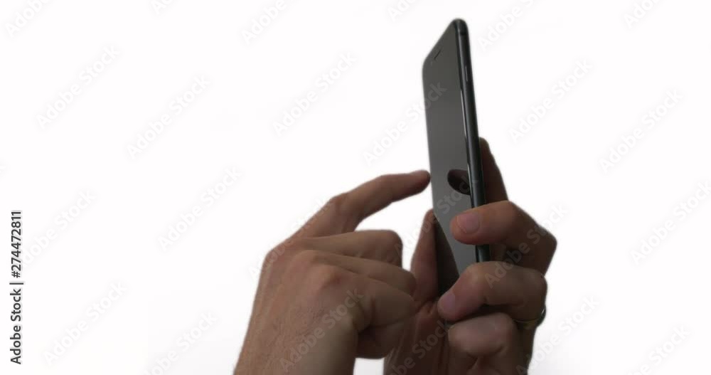 Males hands using black smartphone. Isolated on white background. Easy to luma mask out