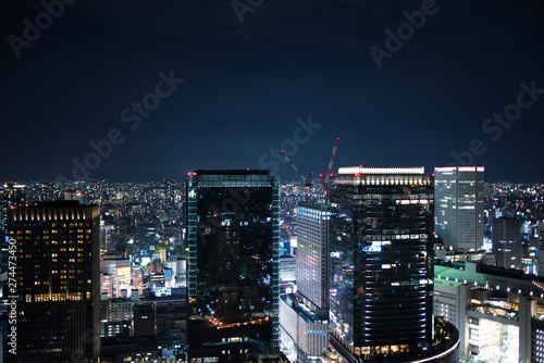 Night skyline of Osaka city. Umeda Sky Building in Japan.