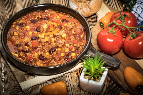 Chili con carne in a clay pan.