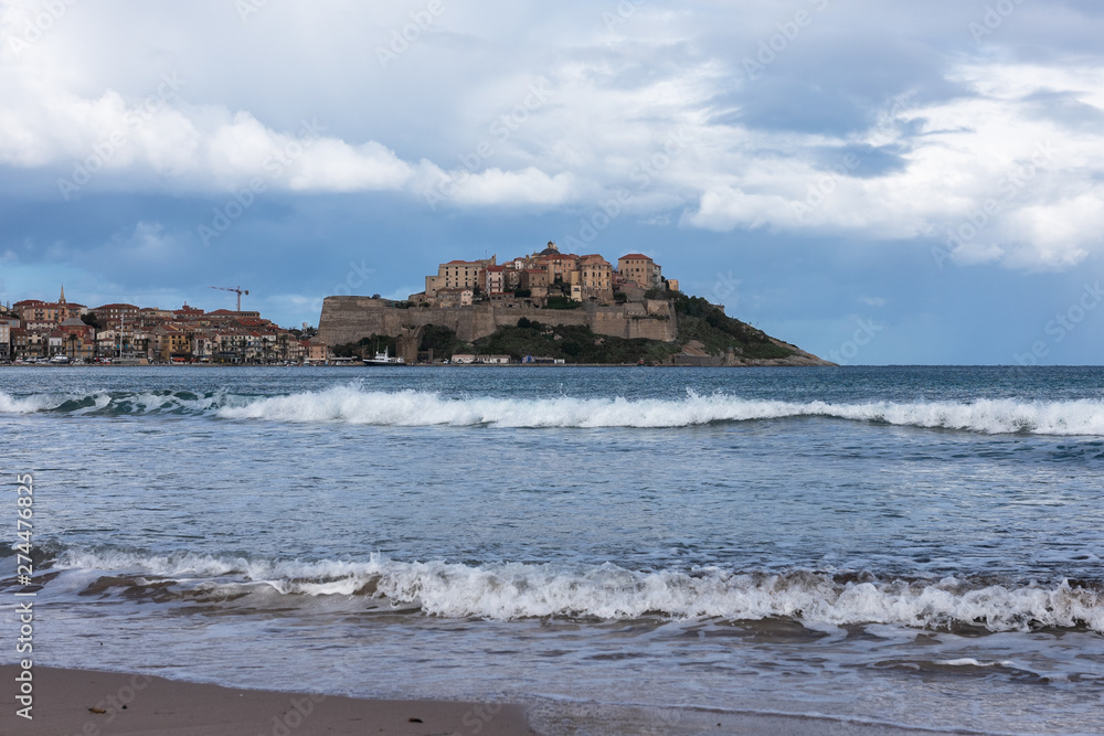 View of the old Corsican city of Calvi in stormy autumn weather, France View of the old Corsican city of Calvi in stormy autumn weather, France