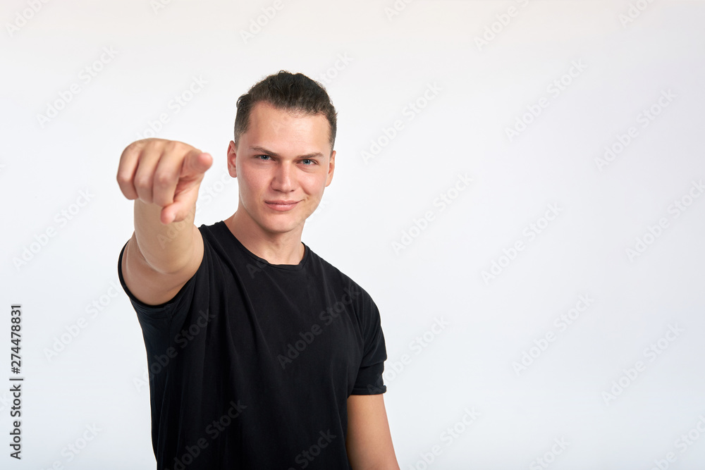 Gesture. Young handsome confident smiling man pointing at you. I choose you. I want you. Studio shot on white background. Gesture. Young handsome confident smiling man pointing at you. I choose you. I want you. Studio shot on white background.