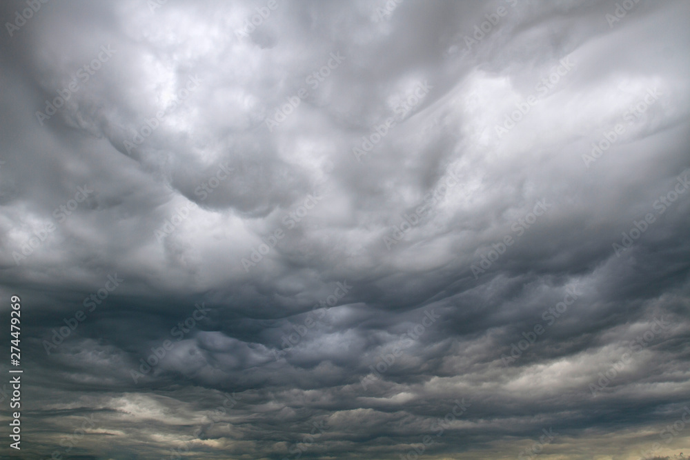 Background of dramatic sky with dark clouds. Sky before a thunder-storm. Background of dramatic sky with dark clouds. Sky before a thunder-storm.