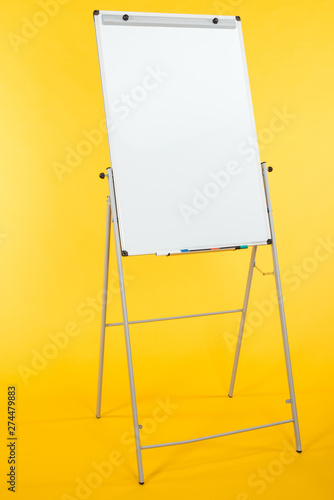 white flipchart with copy space isolated on yellow