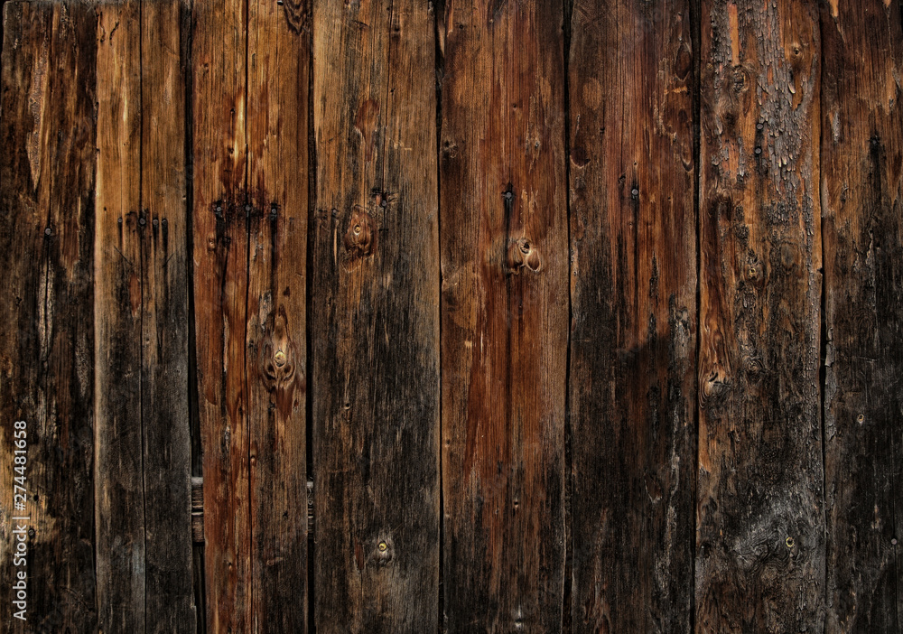 Brown wood board texture for background. Close-up image. Background of the brown wooden wall. Brown wood board texture for background. Close-up image. Background of the brown wooden wall.