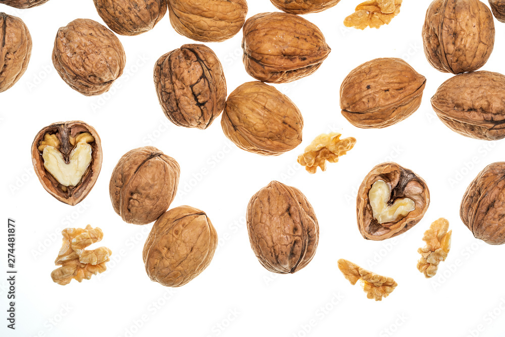Nuts (whole and open) falling. Isolated on white background. Nuts (whole and open) falling. Isolated on white background.