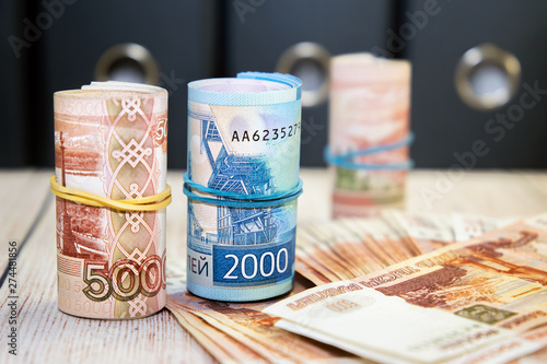 Time to pay taxes. A lot of Russian money. Five thousand ruble bills