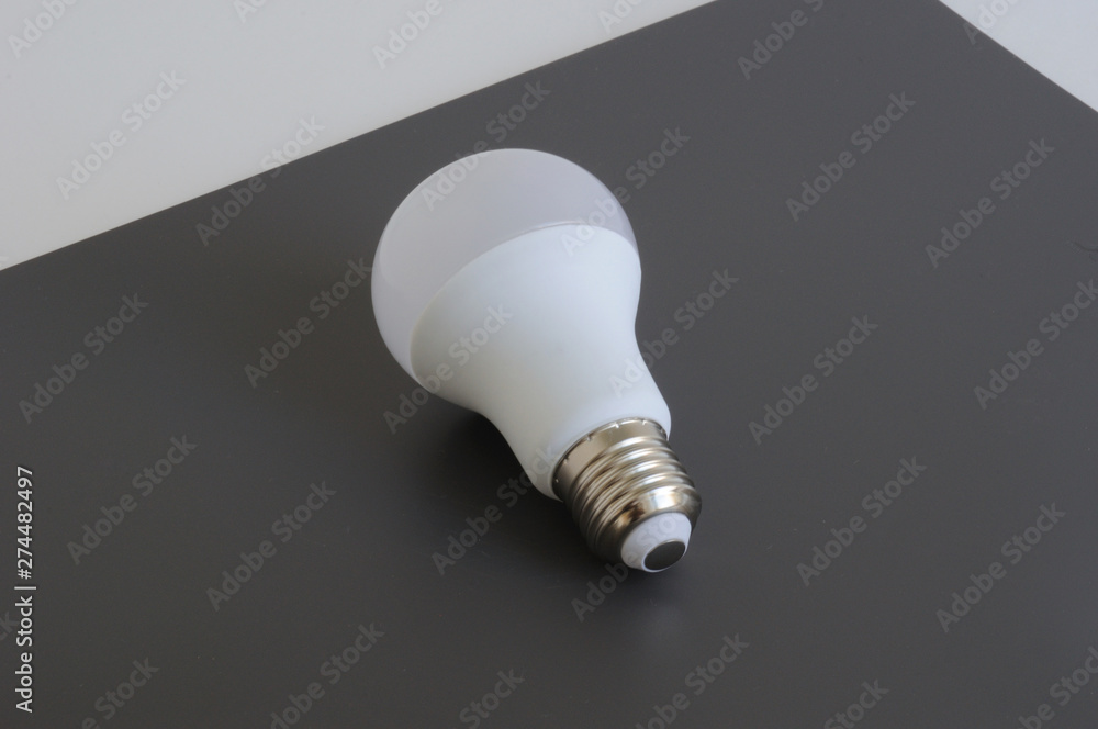 LED bulb. On an abstract gray background. Place for text. LED bulb. On an abstract gray background. Place for text.
