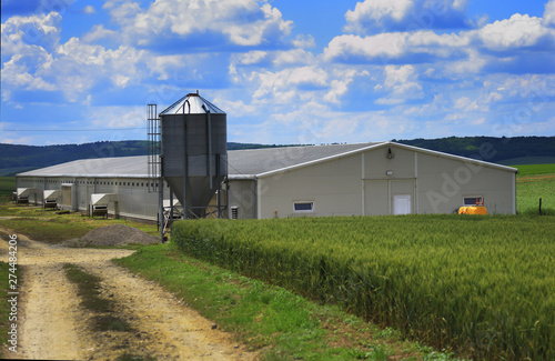Modern farm buildings with silo and cereal