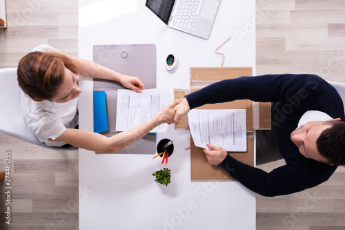 Businessman Shaking Hand With Female Applicant photo