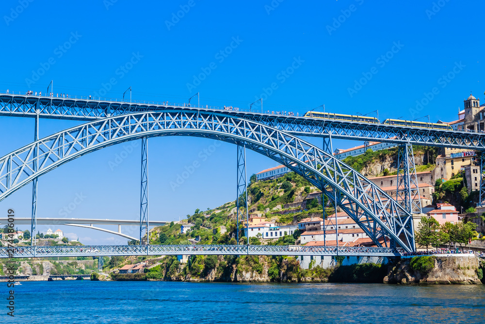 Famous steel bridge dom Luis above connects Old town Porto with Vila Nova de Gaia at river Douro, Portugal.