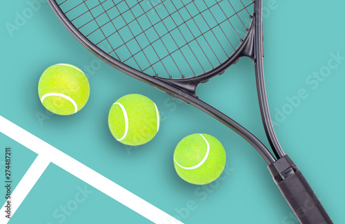 Tennis racket and ball sports on green background © Dmytro Flisak
