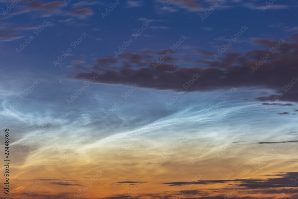 Obraz premium noctilucent clouds at midnight in the sky