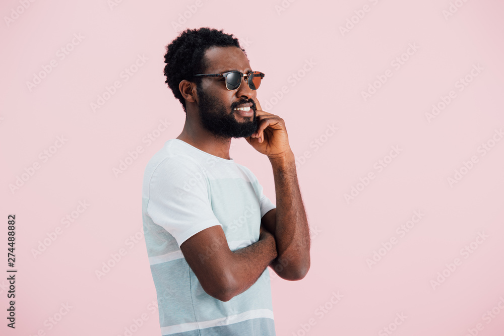 happy african american of man in sunglasses, isolated on pink happy african american of man in sunglasses, isolated on pink