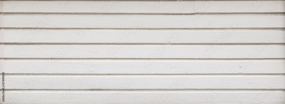 Full frame background of a clean wood board wall painted in white. Copy space. Full frame background of a clean wood board wall painted in white. Copy space.