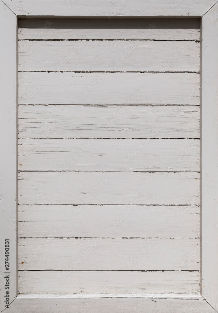 Close-up of part of an old and rustic wood board wall or door painted in white. High resolution full frame background. Copy space. Close-up of part of an old and rustic wood board wall or door painted in white. High resolution full frame background. Copy space.