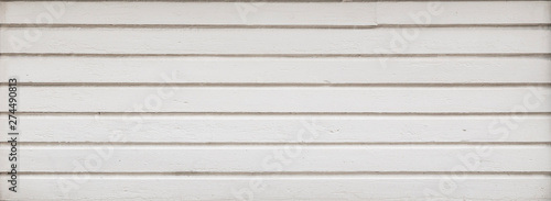 Full frame background of a clean wood board wall painted in white. Copy space.