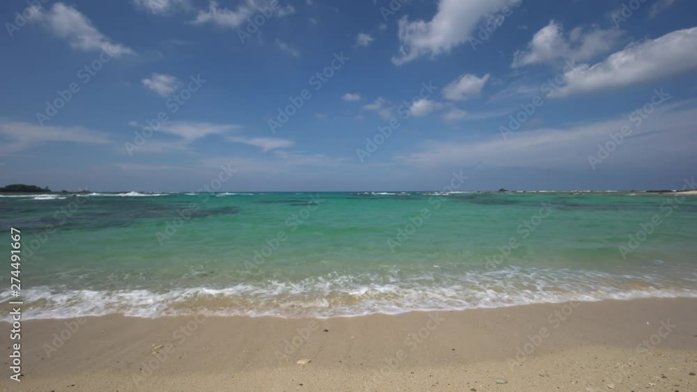 Amami Oshima, Japan - June 16, 2019: Tomori Beach at low tide in Amami Oshima, Japan Amami Oshima, Japan - June 16, 2019: Tomori Beach at low tide in Amami Oshima, Japan